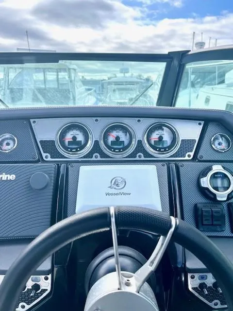 Slide: The Image of 2016 Cruisers Sport Series 328CX dashboard with gauges and VesselView display. - 18