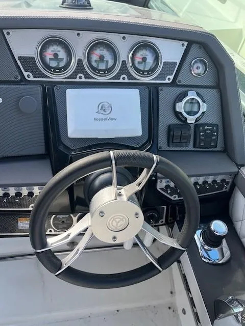 Slide: The Image of 2016 Cruisers Sport Series 328CX dashboard with steering wheel and gauges. - 19