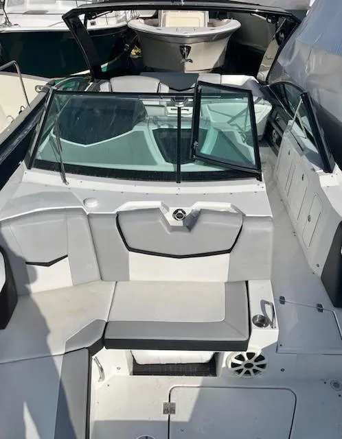Slide: The Image of 2016 Cruisers Sport Series 328CX boat interior with seating and windshield. - 24