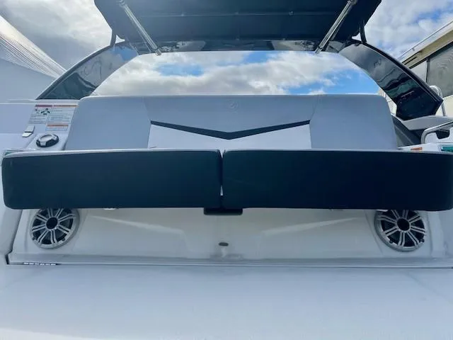 Slide: The Image of 2016 Cruisers Sport Series 328CX boat with cushioned seating and speakers. - 29