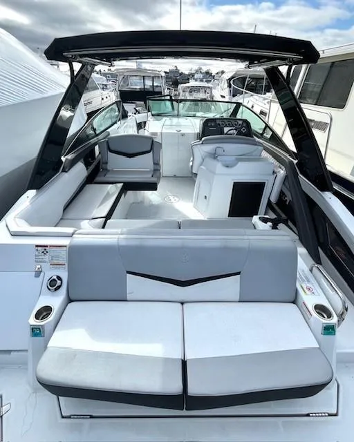 Slide: The Image of 2016 Cruisers Sport Series 328CX boat with spacious seating and modern design. - 7