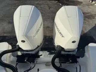 Slide: The Image of Twin Mercury outboard engines on 2023 Boston Whaler 325 Conquest boat. - 41