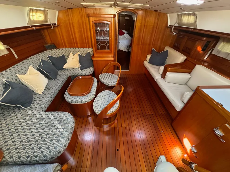 Slide: The Image of Luxurious interior of 2002 Beneteau 50 yacht with elegant wood finish and plush seating. - 2