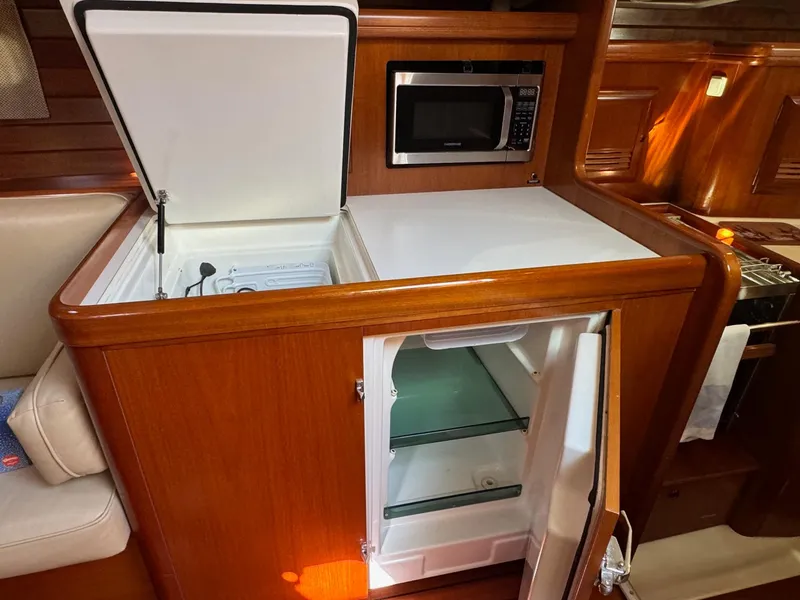 Slide: The Image of Beneteau 50 yacht kitchen with open fridge and microwave, 2002 model. - 33