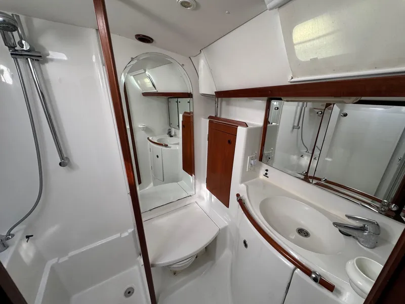 Slide: The Image of Luxurious bathroom in 2002 Beneteau 50 yacht with modern fixtures and elegant design. - 38