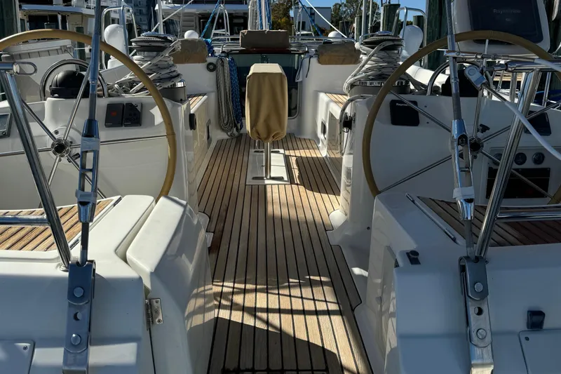 Slide: The Image of Beneteau 50 sailboat cockpit, dual steering wheels, teak deck, 2002 model. - 7