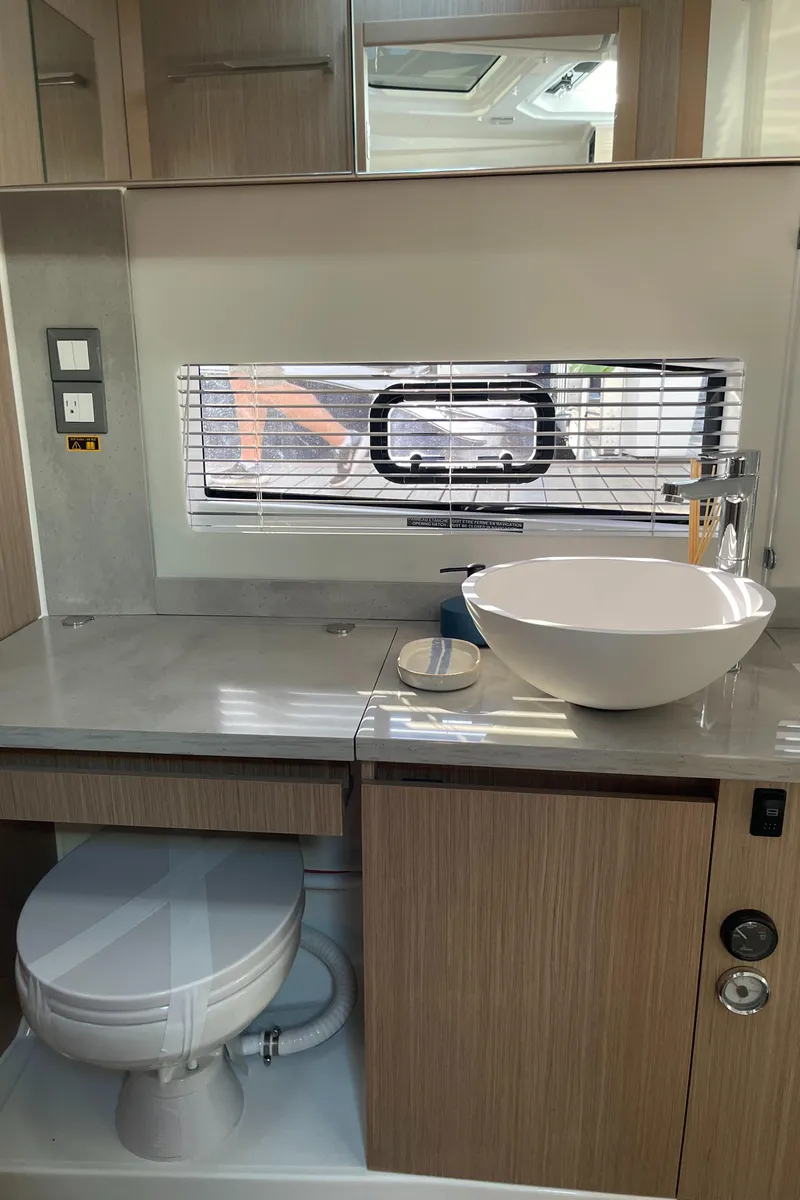 Slide: The Image of 2025 Jeanneau Leader 12.5 WA bathroom with modern sink and toilet. - 19
