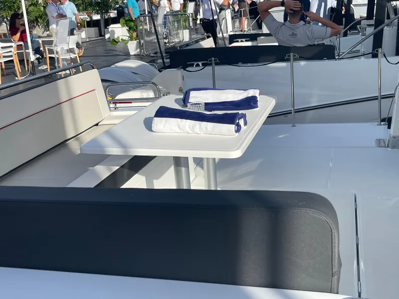 Slide: The Image of 2025 Jeanneau Leader 12.5 WA boat interior with seating and table. - 4