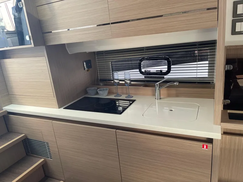 Slide: The Image of Modern kitchen interior of 2025 Jeanneau Leader 12.5 WA yacht, featuring sleek design and amenities. - 9