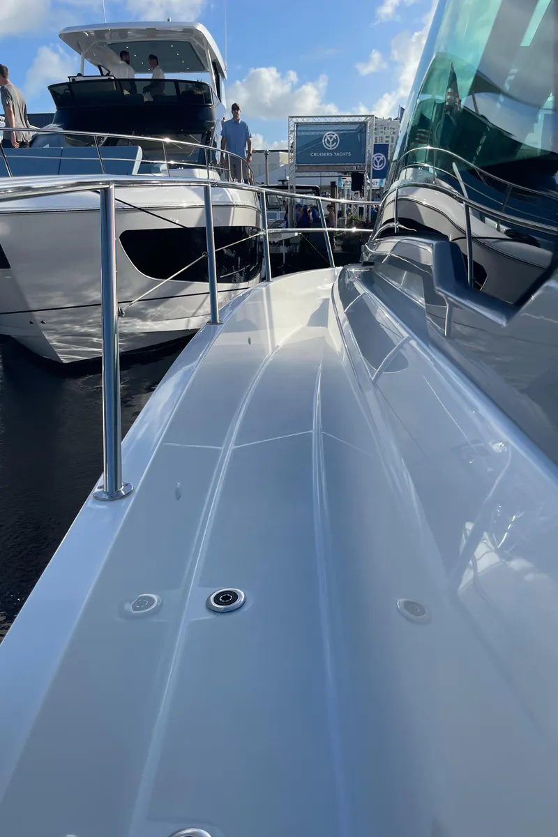 Slide: The Image of 2025 Jeanneau Leader 12.5 WA yacht docked, showcasing sleek design and modern features. - 23