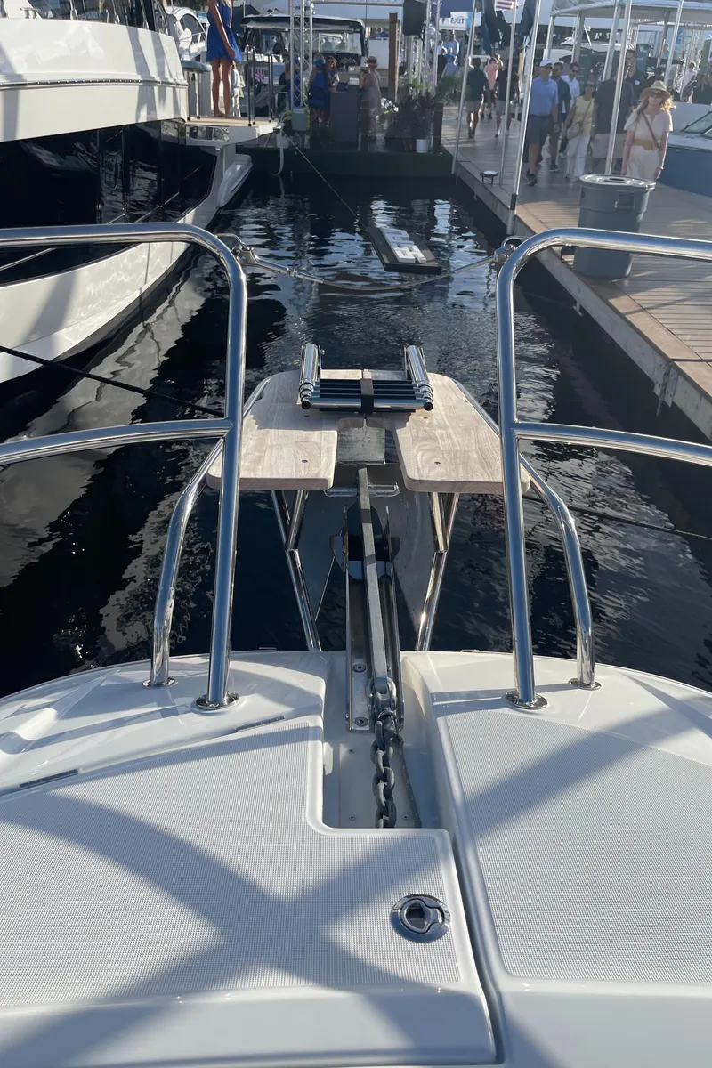 Slide: The Image of 2025 Jeanneau Leader 12.5 WA boat docked at marina, bow view. - 25