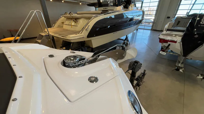 Slide: The Image of 2025 Monterey M65 boat in showroom, showcasing sleek design and modern features. - 15