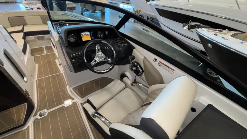 Slide: The Image of 2025 Monterey M65 boat interior with modern dashboard and steering wheel. - 17