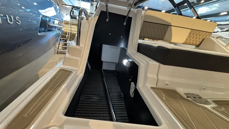 Slide: The Image of 2025 Monterey M65 boat interior with seating and storage area. - 35