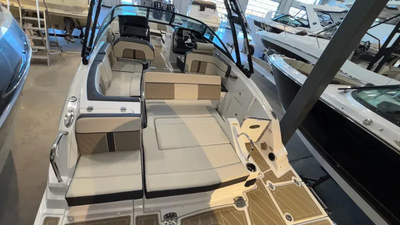 Slide: The Image of 2025 Monterey M65 boat interior with spacious seating and modern design in showroom. - 4