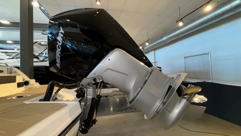 Slide: The Image of 2025 Monterey M65 boat with Mercury outboard motor in showroom. - 46