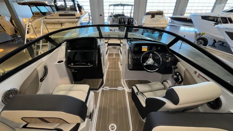 Slide: The Image of Interior of 2025 Monterey M65 boat with modern dashboard and seating. - 8