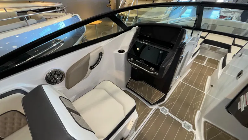 Slide: The Image of Interior of 2025 Monterey M65 boat with modern seating and sleek dashboard design. - 9