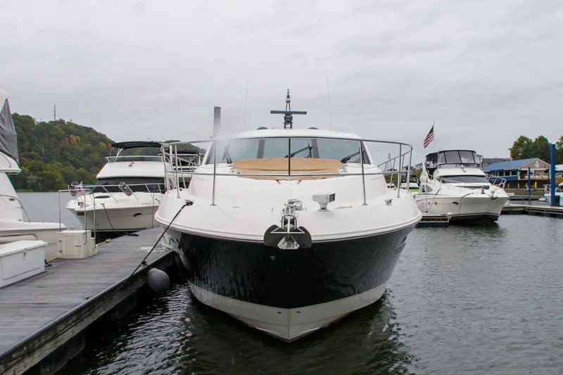 Slide: The Image of 2016 Sea Ray L650 yacht docked at marina, overcast sky. - 19