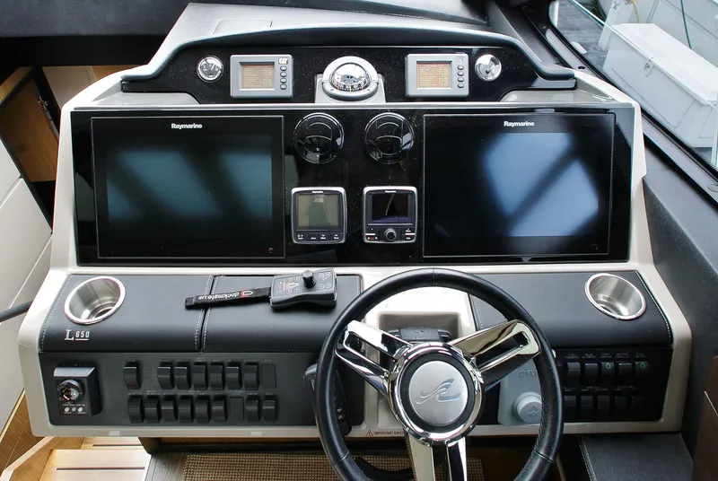 Slide: The Image of 2016 Sea Ray L650 helm with dual displays and modern controls. - 29