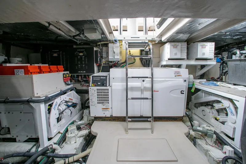 Slide: The Image of Engine room of 2016 Sea Ray L650 yacht with equipment and ladder. - 34