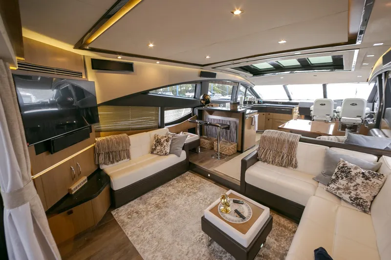 Slide: The Image of Luxurious interior of 2016 Sea Ray L650 yacht with modern furnishings and panoramic windows. - 42