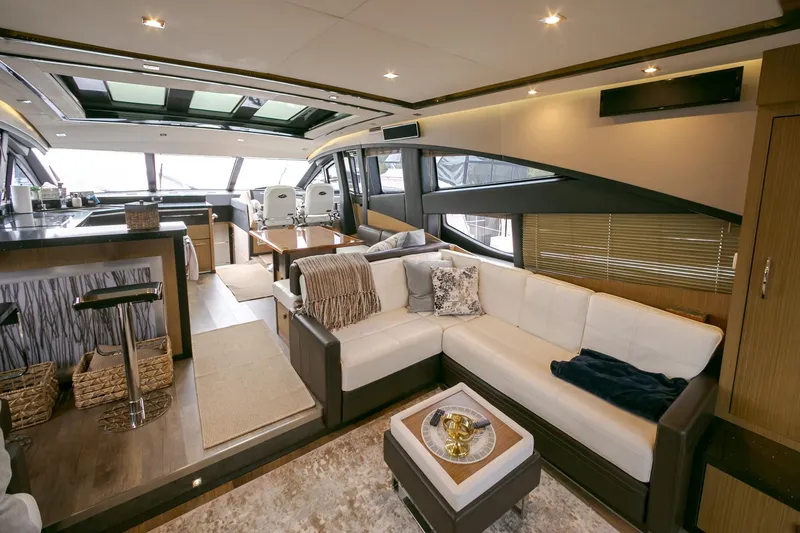 Slide: The Image of Luxurious interior of 2016 Sea Ray L650 yacht with modern seating and elegant decor. - 44