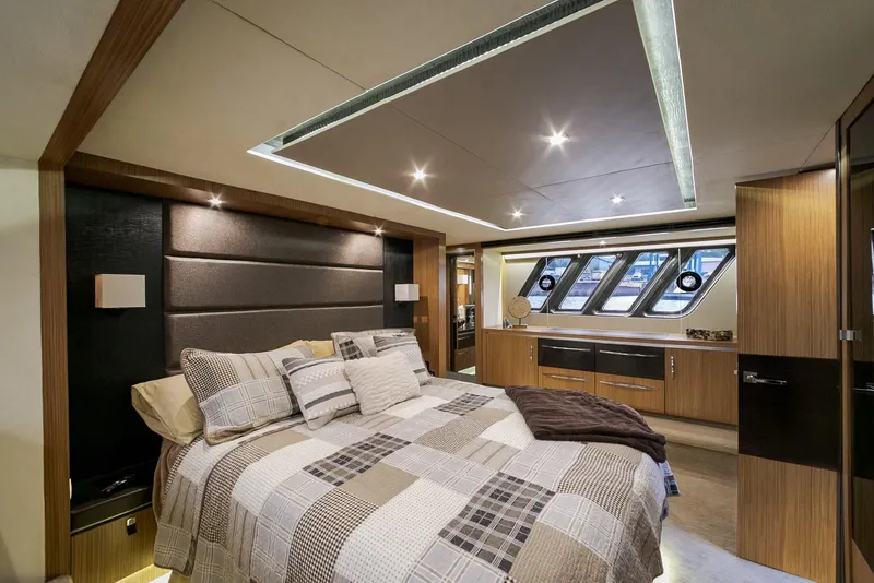 Slide: The Image of Luxurious bedroom interior of 2016 Sea Ray L650 yacht with modern design and ample lighting. - 47