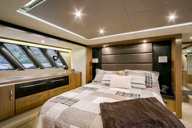 Slide: The Image of Luxurious 2016 Sea Ray L650 yacht bedroom with modern design and elegant lighting. - 48