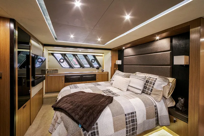 Slide: The Image of Luxurious 2016 Sea Ray L650 yacht bedroom with modern design and elegant lighting. - 49