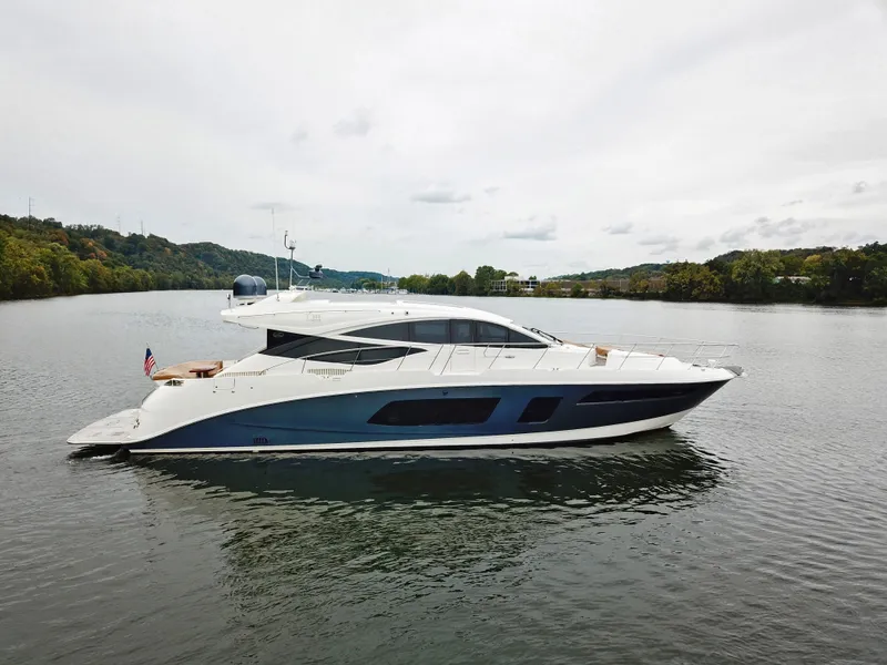 Slide: The Image of 2016 Sea Ray L650 yacht cruising on a calm river. - 6