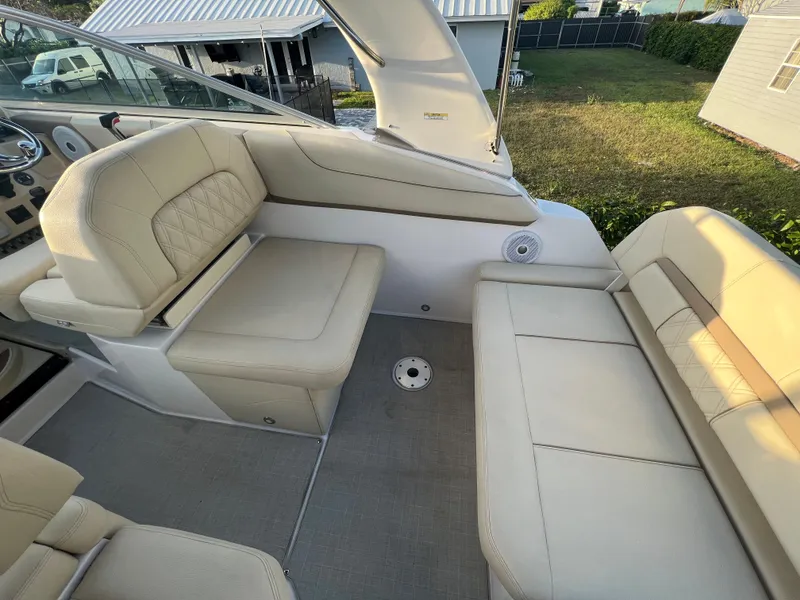 Slide: The Image of 2020 Regal 26 XO boat interior with beige seating and modern design. - 18