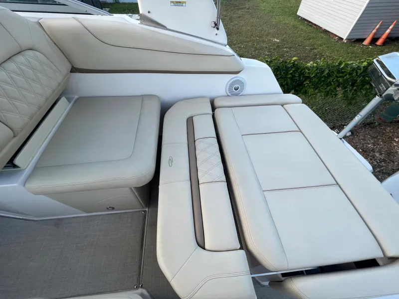 Slide: The Image of 2020 Regal 26 XO boat interior with beige leather seating and speaker. - 24