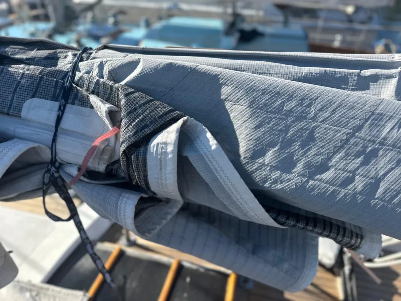 Slide: The Image of Close-up of a 1980 Skye 51 Ketch sailboat's sail, neatly folded and secured. - 19