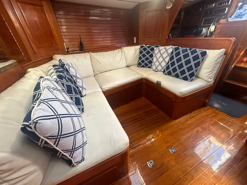 Slide: The Image of Luxurious interior of 1980 Skye 51 Ketch sailboat with plush seating and decorative pillows. - 21