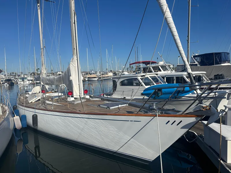 Slide: The Image of 1980 Skye 51 Ketch sailboat docked in marina under clear blue sky. - 3