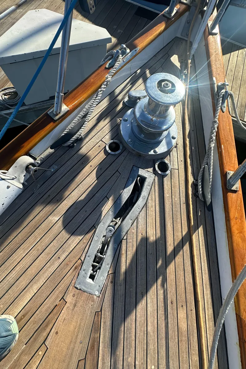 Slide: The Image of Deck of 1980 Skye 51 Ketch sailboat with winch and wooden details. - 39