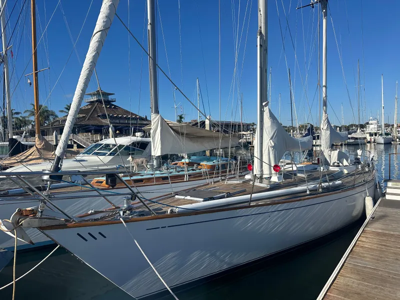 Slide: The Image of 1980 Skye 51 Ketch sailboat docked at marina under clear blue sky. - 4