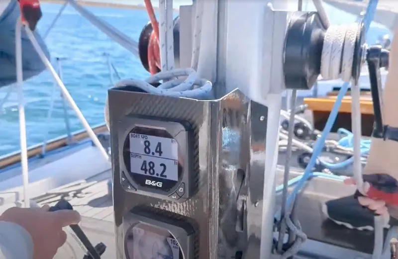 Slide: The Image of Sailboat Skye 51 Ketch cockpit with navigation instruments, displaying speed and depth. - 45