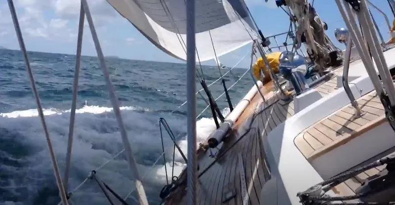 Slide: The Image of Sailing Skye 51 Ketch Kaufman & Ladd, 1980 model, navigating ocean waves. - 48