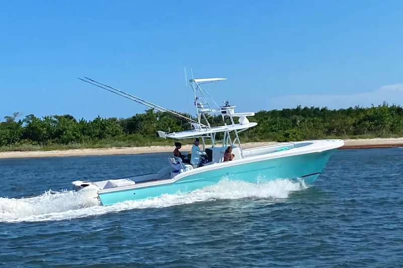 The Image of 2006 Buddy Davis 34 Center Console boat cruising on open water. - 0