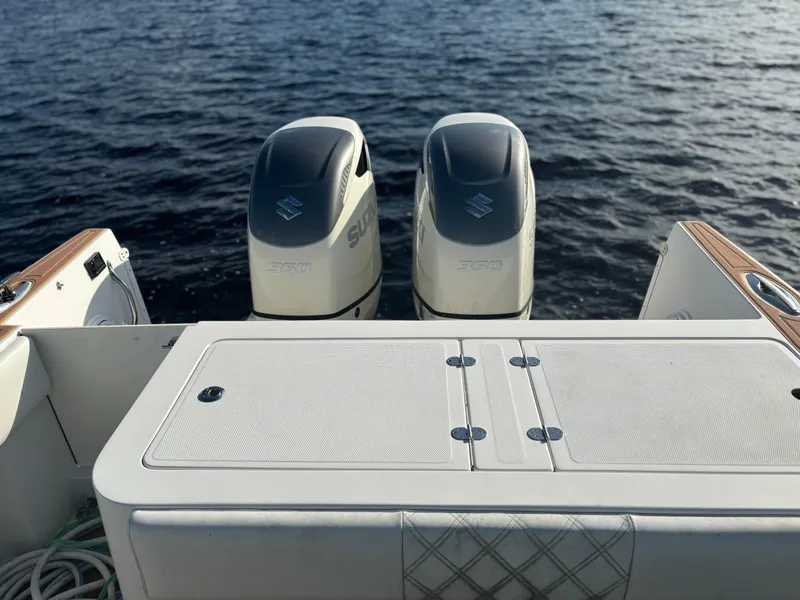 Slide: The Image of 2006 Buddy Davis 34 Center Console with twin outboard motors on water. - 15