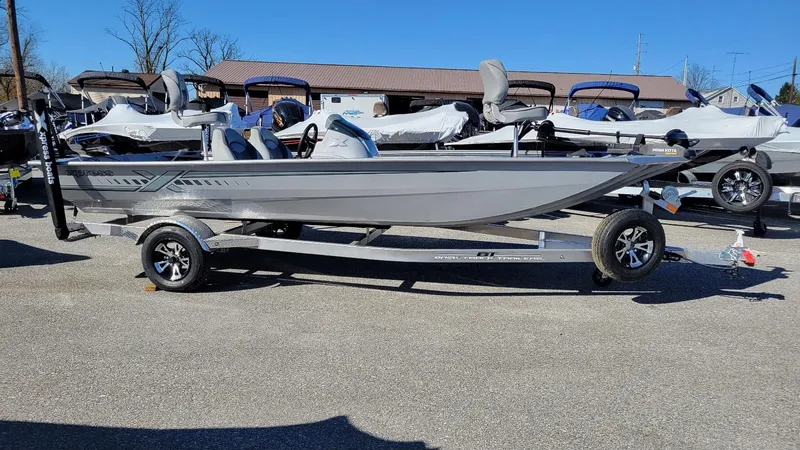 Slide: The Image of 2025 Xpress XP180 Bass boat with Yamaha F25 hp engine on trailer. - 1