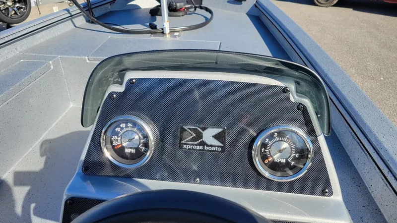 Slide: The Image of 2025 Xpress XP180 Bass boat dashboard with speedometer and tachometer. - 7