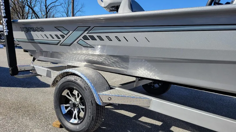 Slide: The Image of 2025 Xpress XP180 Bass boat with Yamaha F25 hp engine on trailer. - 9
