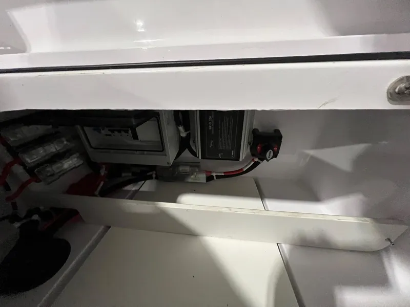 Slide: The Image of Electrical components inside a 2022 Axopar 28 CABIN boat compartment. - 39