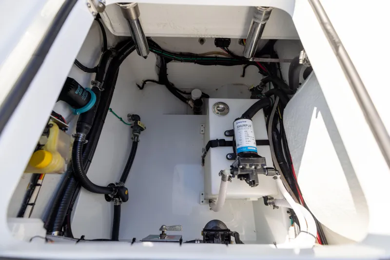Slide: The Image of Engine compartment of 2024 Freeman 28 boat, showcasing wiring and components. - 14