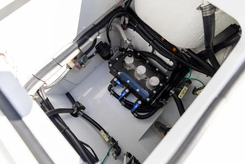 Slide: The Image of 2024 Freeman 28 boat engine compartment with wiring and components. - 15