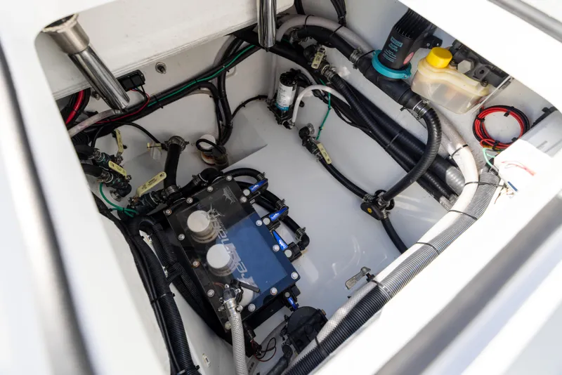 Slide: The Image of 2024 Freeman 28 boat engine compartment with wiring and components. - 16