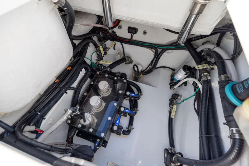Slide: The Image of 2024 Freeman 28 boat engine compartment with wiring and components. - 17